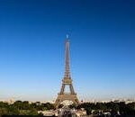 Stunning daylight shot capturing the Eiffel Tower with clear blue skies in Paris.
